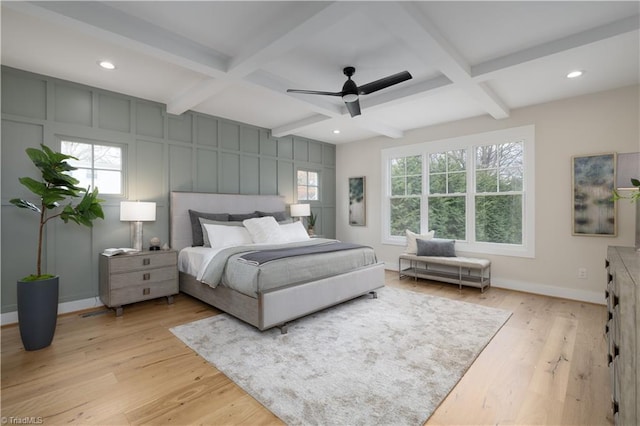 bedroom with coffered ceiling, light wood-style floors, beam ceiling, baseboards, and recessed lighting
