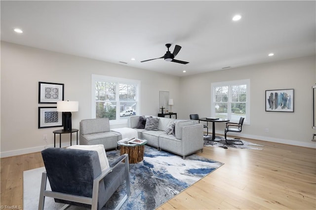 living area featuring ceiling fan, wood finished floors, recessed lighting, and baseboards