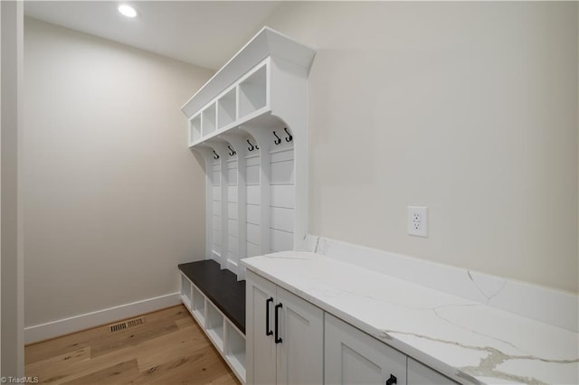 mudroom with light wood-style flooring, recessed lighting, and baseboards