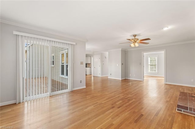 unfurnished living room featuring light hardwood / wood-style flooring, ornamental molding, and ceiling fan