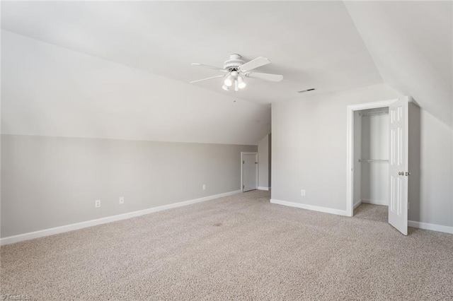 bonus room featuring light carpet, vaulted ceiling, and ceiling fan