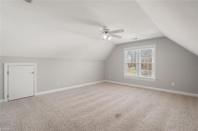 bonus room with lofted ceiling, ceiling fan, and carpet flooring