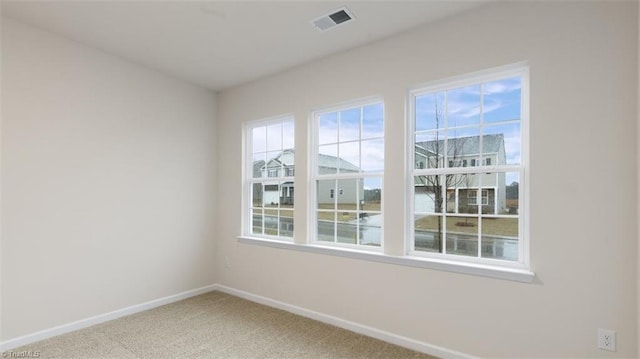 spare room featuring carpet flooring