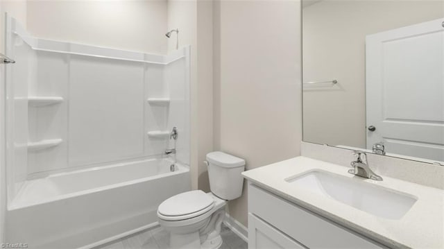 full bathroom featuring washtub / shower combination, toilet, tile patterned flooring, and vanity