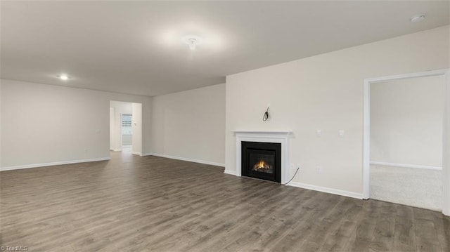 unfurnished living room with hardwood / wood-style floors