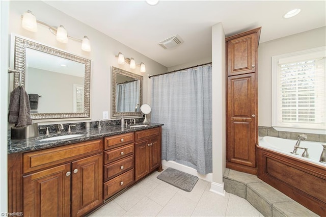 full bathroom featuring double vanity, a garden tub, and a shower with shower curtain