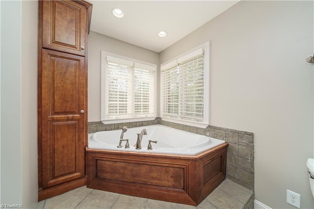 full bath featuring a bath, tile patterned flooring, and recessed lighting