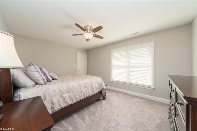 bedroom featuring baseboards, carpet floors, and ceiling fan