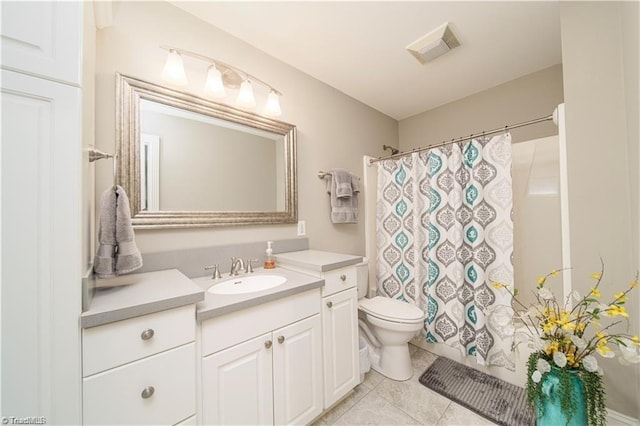 full bath featuring toilet, tile patterned floors, vanity, and curtained shower