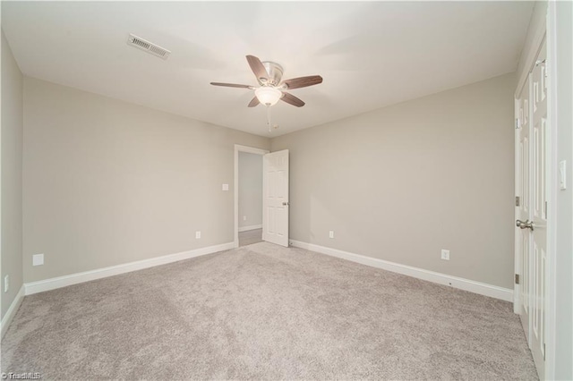 unfurnished bedroom with carpet, baseboards, and a ceiling fan
