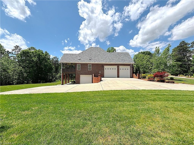 view of front of property featuring concrete driveway, brick siding, and a front lawn
