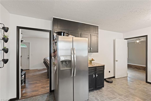 267 Pine Ridge Trl, Pinnacle, NC 27043 - kitchen with stainless steel fridge, a textured ceiling, light countertops, and ceiling fan