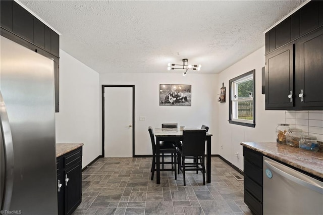 267 Pine Ridge Trl, Pinnacle, NC 27043 - dining space with stone finish flooring, a textured ceiling, and a chandelier