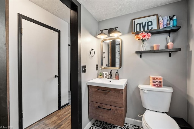 267 Pine Ridge Trl, Pinnacle, NC 27043 - half bath with vanity, wood finished floors, and a textured ceiling