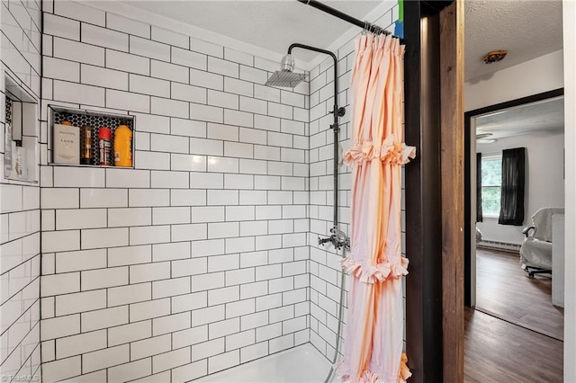 267 Pine Ridge Trl, Pinnacle, NC 27043 - bathroom featuring a shower with shower curtain, wood finished floors, and a textured ceiling