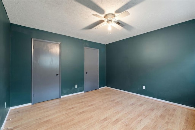 267 Pine Ridge Trl, Pinnacle, NC 27043 - unfurnished bedroom with wood finished floors, a textured ceiling, and ceiling fan