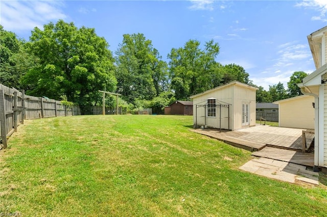 267 Pine Ridge Trl, Pinnacle, NC 27043 - fenced backyard with a wooden deck and a shed