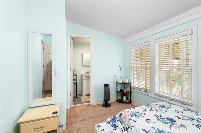 carpeted bedroom featuring vaulted ceiling and baseboards