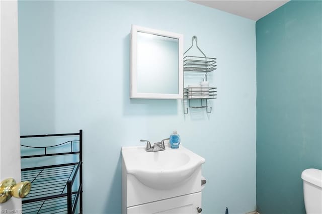 half bath with vanity and toilet