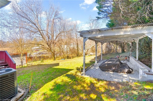 view of yard featuring an outdoor fire pit, cooling unit, a pergola, and a patio