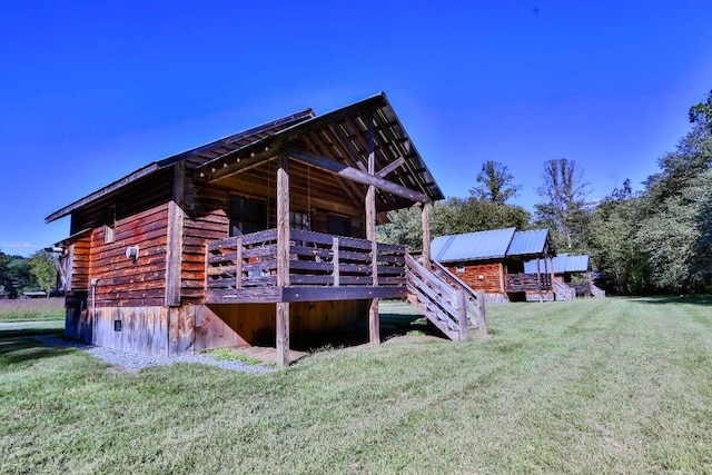 view of side of home featuring a lawn