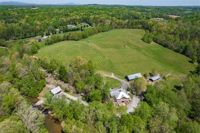 birds eye view of property with a rural view