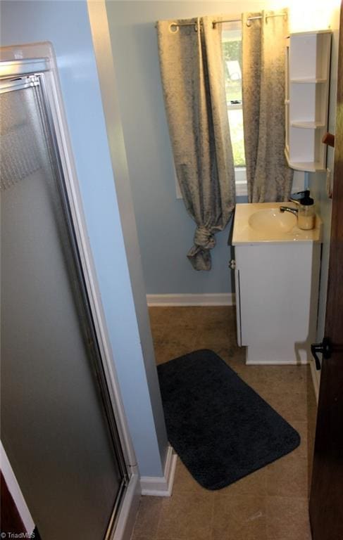 bathroom with vanity and an enclosed shower