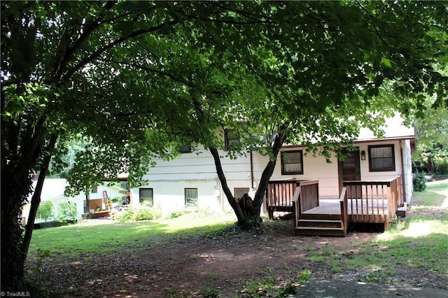 back of house featuring a wooden deck