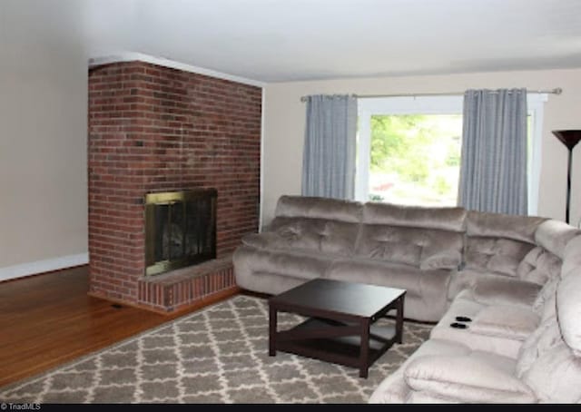 living room featuring hardwood / wood-style floors and a fireplace