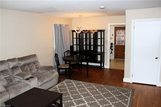 living room with dark hardwood / wood-style flooring