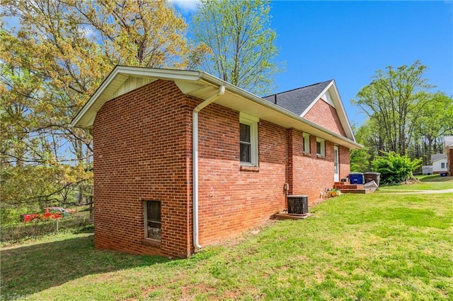 4478 Ogburn Ave, Winston-Salem, NC 27105 - view of home's exterior with a yard, brick siding, and cooling unit