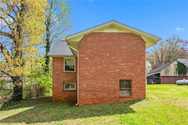4478 Ogburn Ave, Winston-Salem, NC 27105 - view of side of home featuring a yard and brick siding