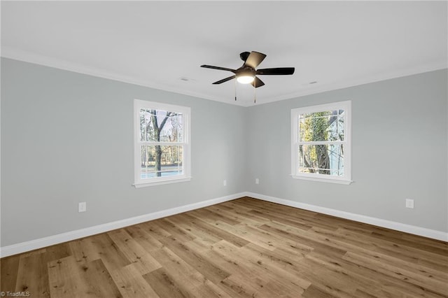 spare room with crown molding, ceiling fan, and light wood-type flooring