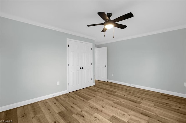 spare room with ornamental molding, light hardwood / wood-style floors, and ceiling fan