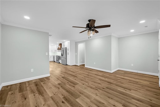 unfurnished living room featuring crown molding, ceiling fan, and light wood-type flooring