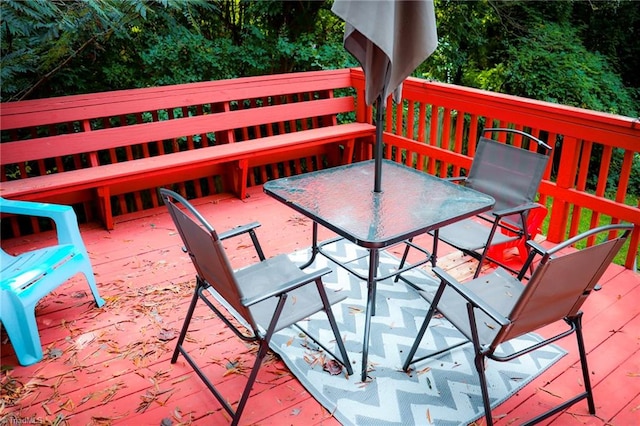 wooden deck with outdoor dining area