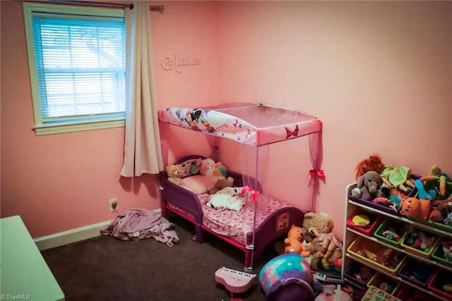 bedroom featuring baseboards and carpet floors