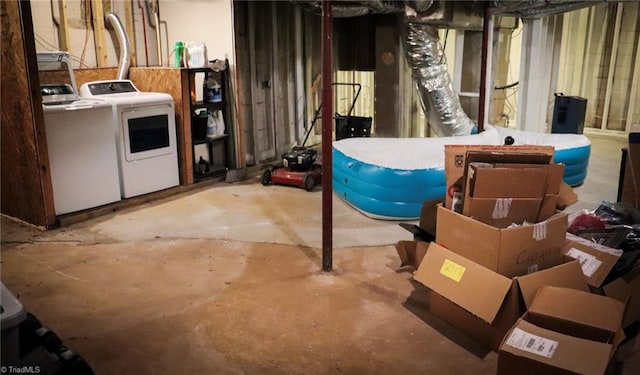 unfinished basement with washing machine and dryer