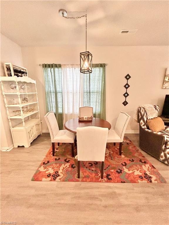 dining room featuring wood-type flooring