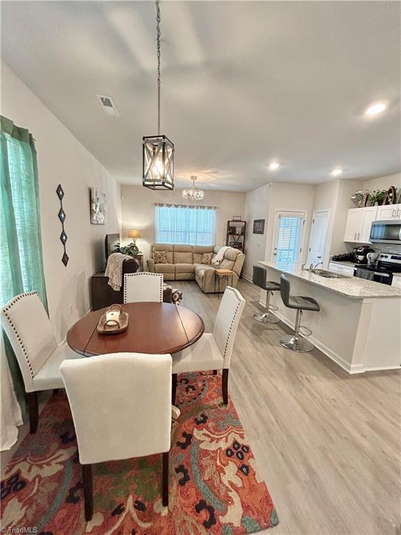 dining area featuring light hardwood / wood-style floors