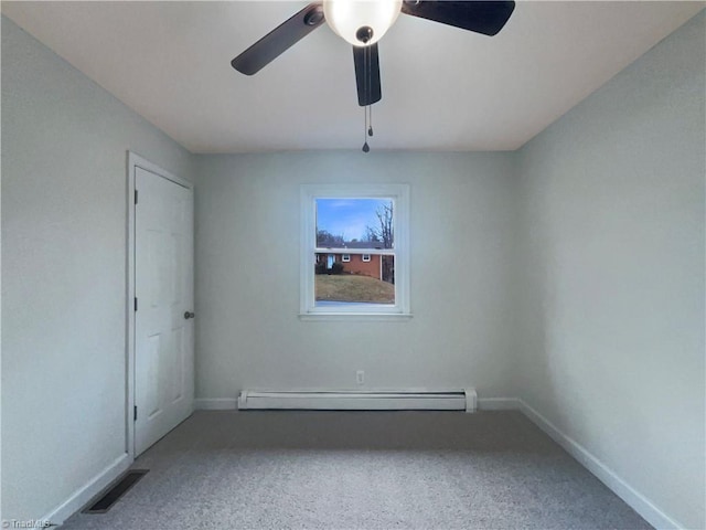 unfurnished room with a baseboard heating unit, visible vents, baseboards, and a ceiling fan