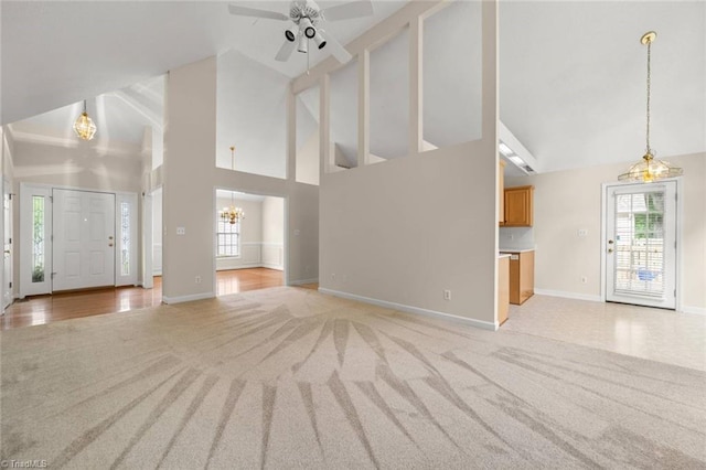 145 Millers Crossing Ct, Winston-Salem, NC 27103 - unfurnished living room featuring a chandelier, light colored carpet, high vaulted ceiling, healthy amount of natural light, and a ceiling fan