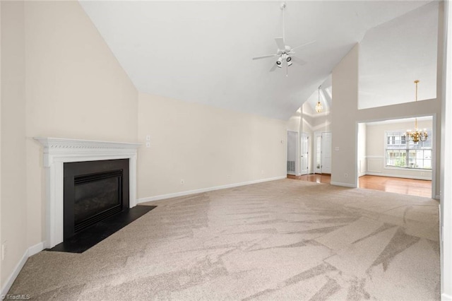 145 Millers Crossing Ct, Winston-Salem, NC 27103 - unfurnished living room featuring carpet floors, high vaulted ceiling, a chandelier, a fireplace with flush hearth, and a ceiling fan