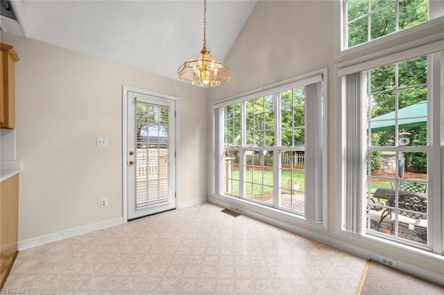 145 Millers Crossing Ct, Winston-Salem, NC 27103 - unfurnished dining area with plenty of natural light, a chandelier, and high vaulted ceiling