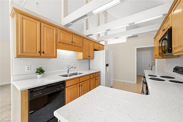 145 Millers Crossing Ct, Winston-Salem, NC 27103 - kitchen featuring black appliances, tasteful backsplash, lofted ceiling, and a peninsula