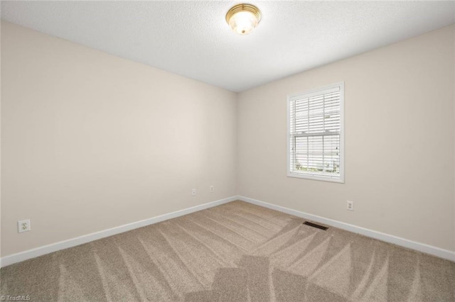 145 Millers Crossing Ct, Winston-Salem, NC 27103 - carpeted empty room with baseboards and a textured ceiling
