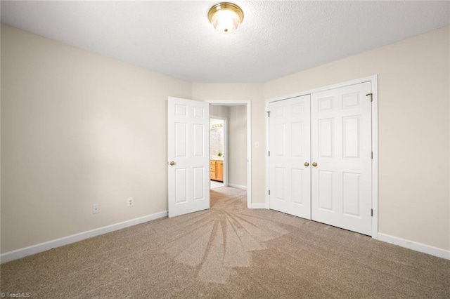 145 Millers Crossing Ct, Winston-Salem, NC 27103 - unfurnished bedroom featuring carpet floors, a closet, and a textured ceiling