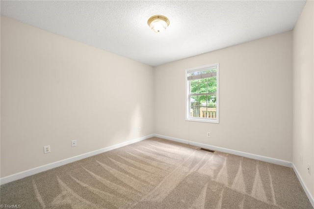 145 Millers Crossing Ct, Winston-Salem, NC 27103 - carpeted empty room featuring baseboards and a textured ceiling