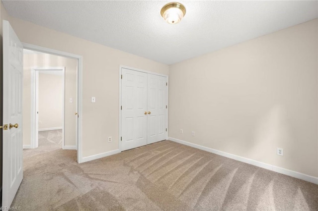 145 Millers Crossing Ct, Winston-Salem, NC 27103 - unfurnished bedroom with carpet floors, a closet, and a textured ceiling