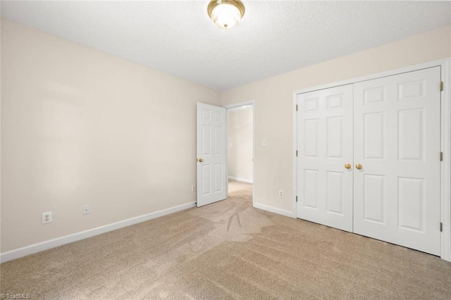 145 Millers Crossing Ct, Winston-Salem, NC 27103 - unfurnished bedroom with carpet, a closet, and a textured ceiling